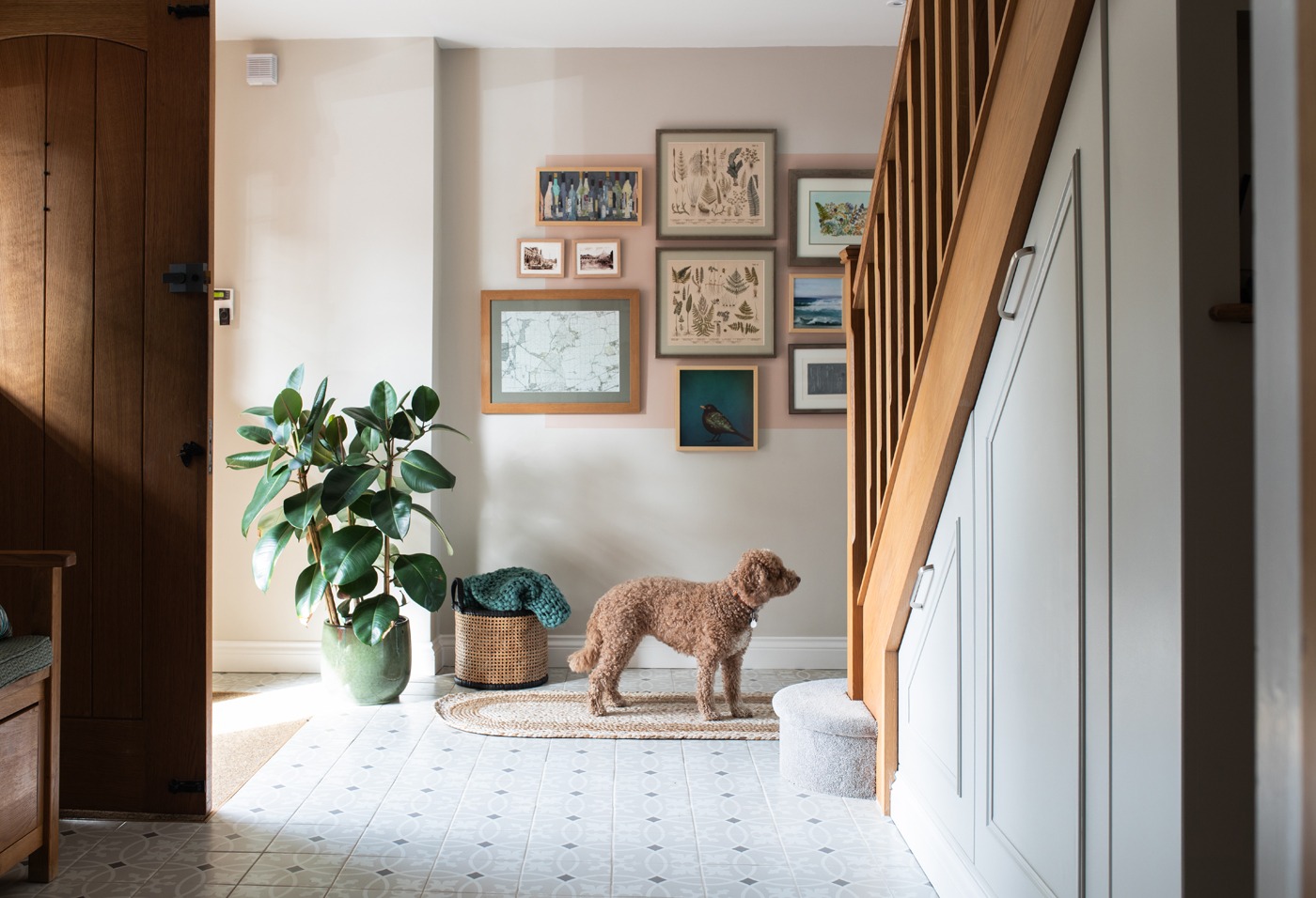 28-This-inviting-hallway-balances-style-and-practicality-with-under-stair-storage-patterned-floor-tiles-and-a-cosy-jute-runner