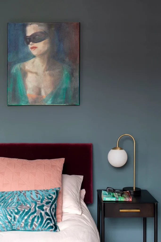 Free Download Design Companion Victorian Terrace Renovation: a moody bedroom corner with a plush velvet headboard in deep berry and soft blush and teal accents.