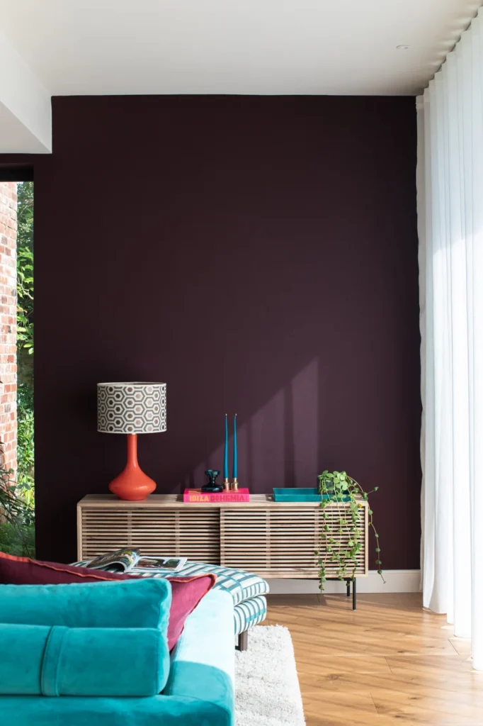 Interior Designer in Chinnor created this bold dark statement wall with teal accessories