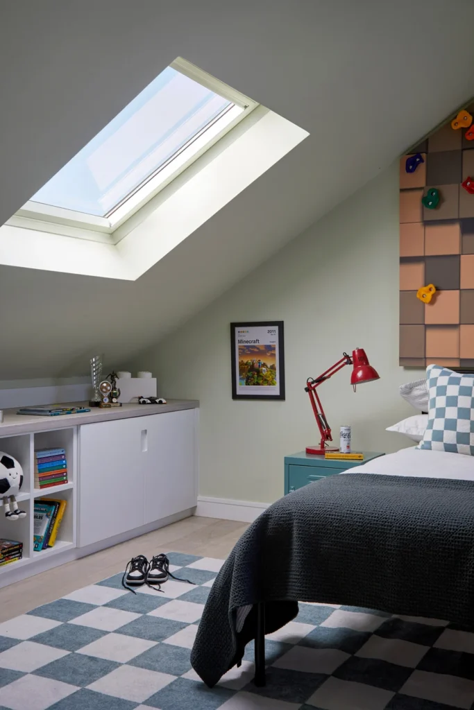 Chalfont St Peter interior designer created this child's bedroom in an attic space with a climbing wall behind the bed