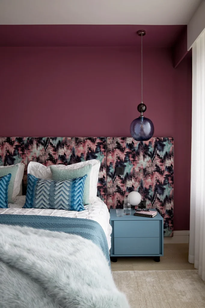A Wandsworth interior designer created this bedroom with mulberry wall colour