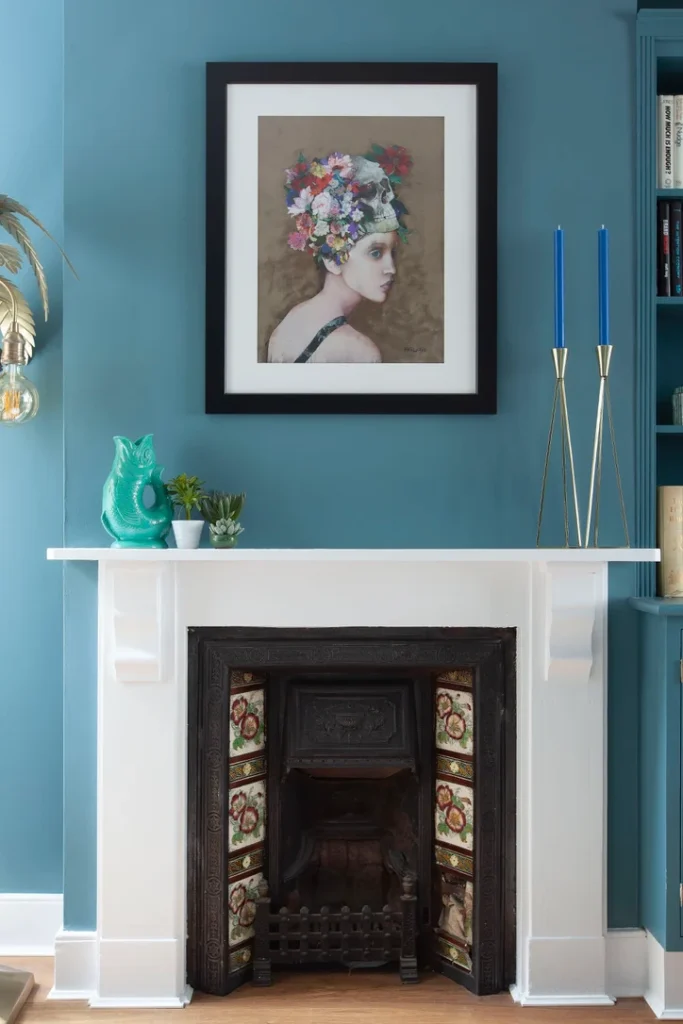 Marlow interior designer Kate Lovejoy chose this bold blue wall colour to contrast the cast iron fireplace with a white surround