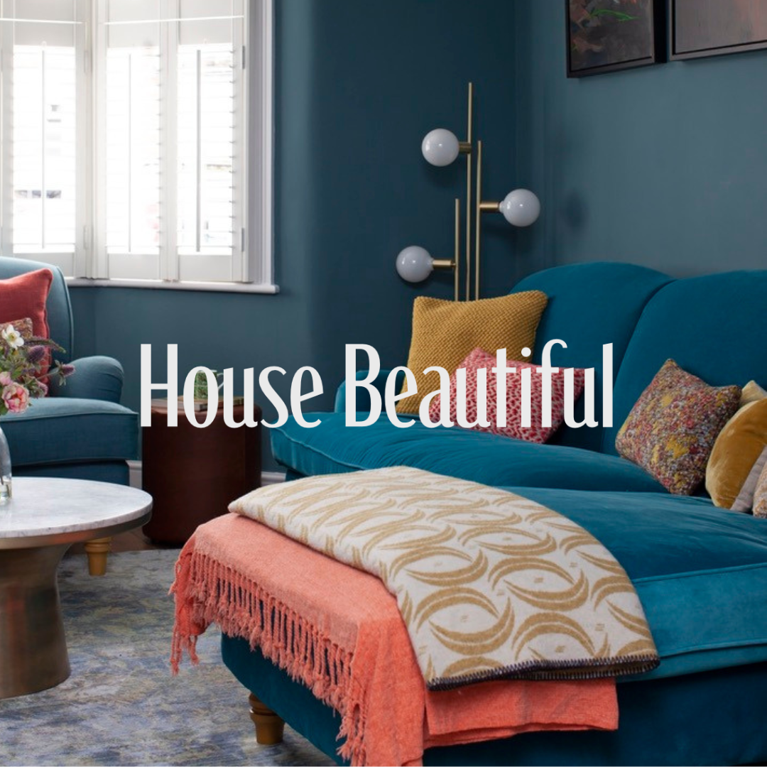 A teal colour drenched living room that had press coverage in House Beautiful