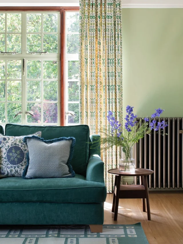 Even though it’s a big room, the living room at St Timothee feels really connected to the garden.

The soft green walls, patterned curtains and upholstery bring the outside in without trying too hard. You notice the view wherever you are in the room, which helps it all really calm and grounded.

Sarah has such a good instinct for colour in her garden, so she totally embraced the idea of carrying that palette through to the inside. The cushions, rug and lamps add energy, but we made sure that nothing feels loud. It’s all balanced.

Because the room looks both ways, out to the garden and through to the dining room, it feels open and full of light, but still warm and welcoming.

Would you be brave enough to go for green on green?

Photography by @cecelinatornberg 
Styling by @interior.therapy 

#interiordesign #colourlovers #greenroom #gardeninspired #curtainsandcushions #sittingroomstyle #englishhomes #homedecorideas #colourfulhome #interiorinspo #designedforliving #sttimothee